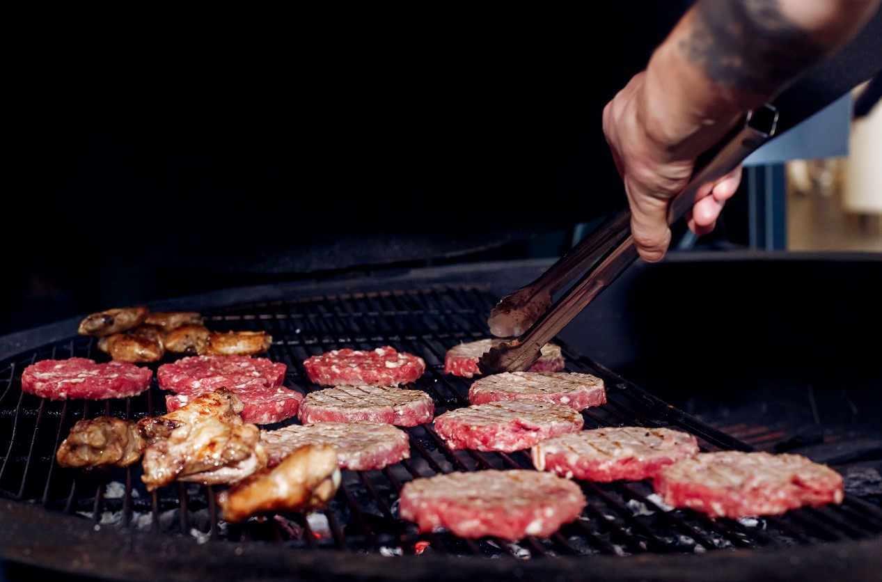 Grilling burgers in the park