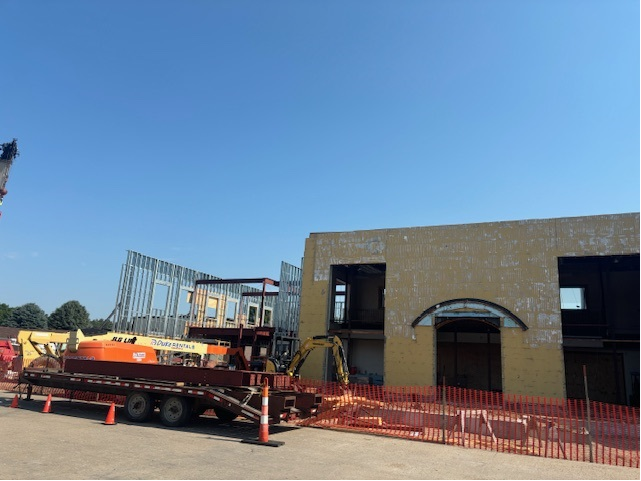 Exterior of new Explorers branch with construction equipment. 