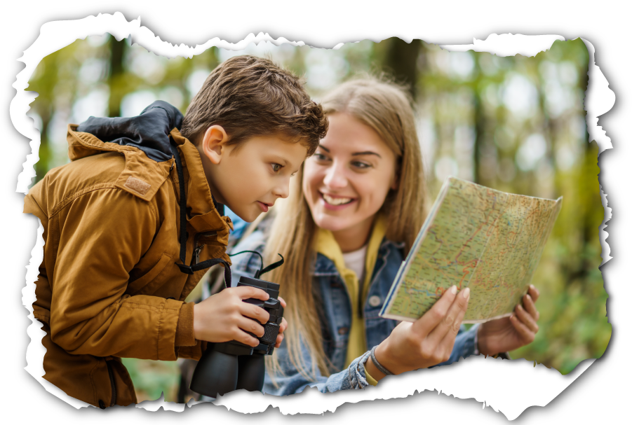 Mother and son looking at map outdoors.